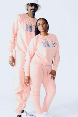 Shante Taylor with her husband Snoop Dogg promoting their clothing line.